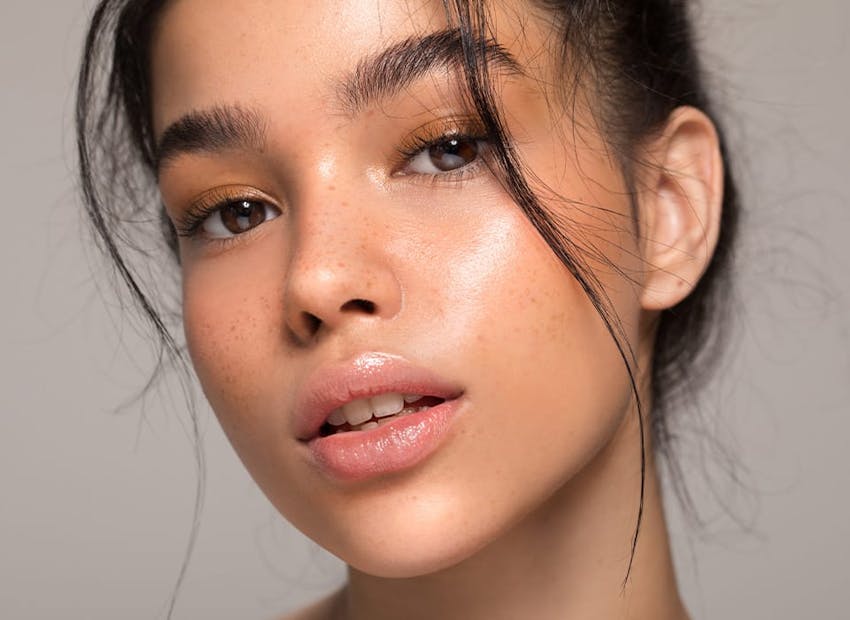 close up of woman with little pieces of hair in the front of her head