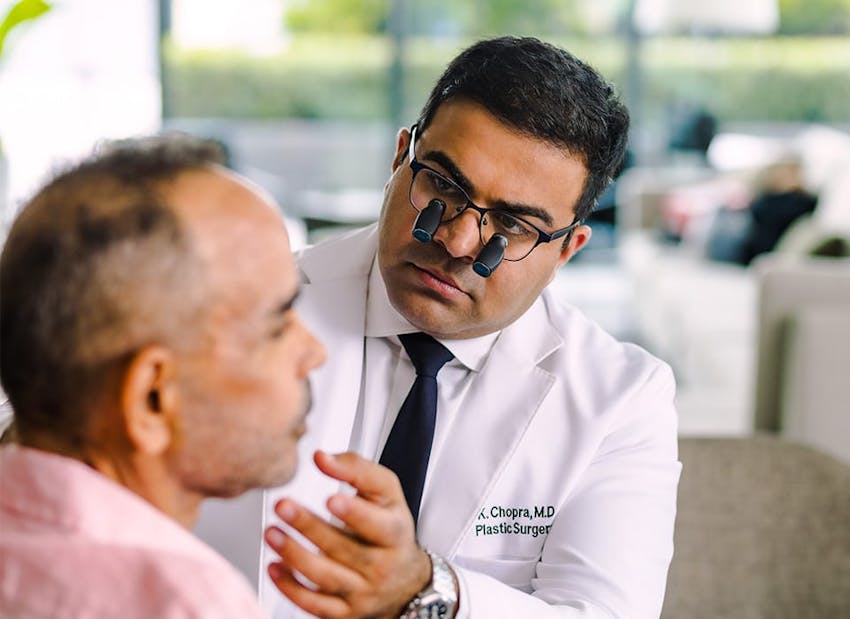 Dr. Chopra examining patient