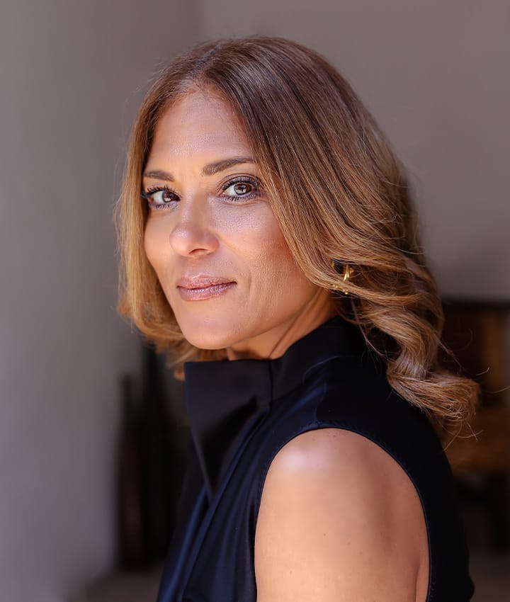 woman in black shirt facing the left