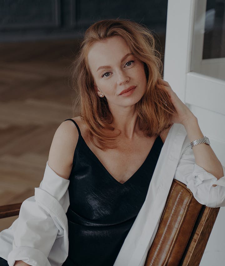 woman sitting in chair posing