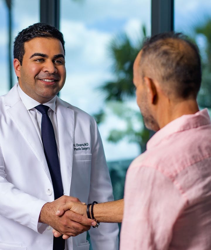 Dr. Chopra shaking hands with his patient