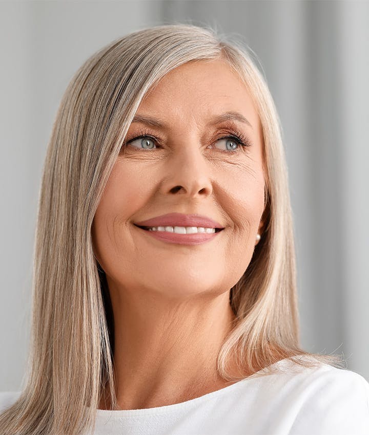 woman smiling and looking to the right