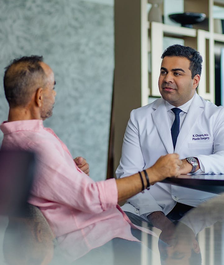 Dr. Chopra talking to male patient