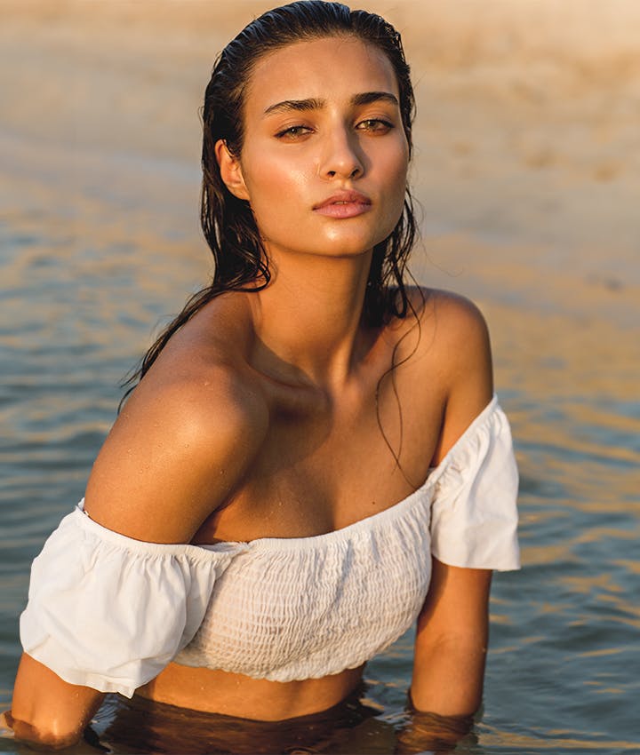 woman in a white shirt in the ocean