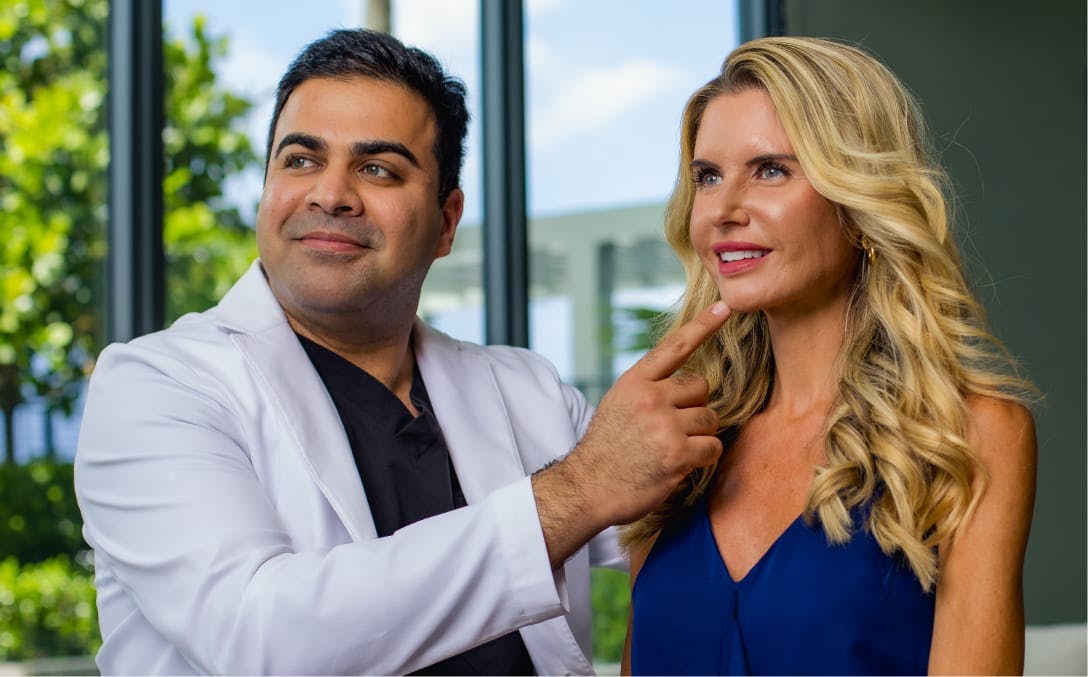 Dr. Chopra with a female patient