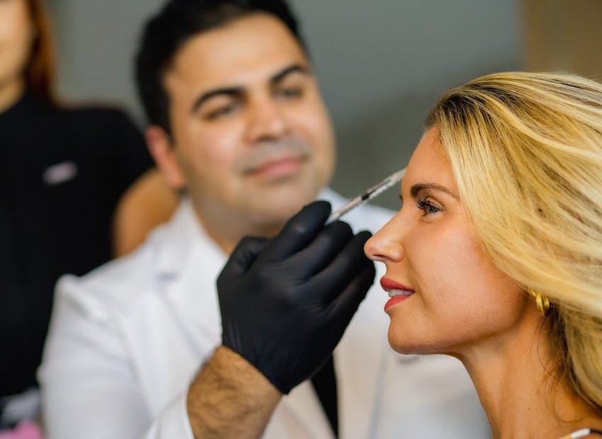 Dr. Chopra administering an injectable treatment