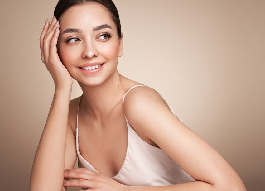 woman resting head in hand