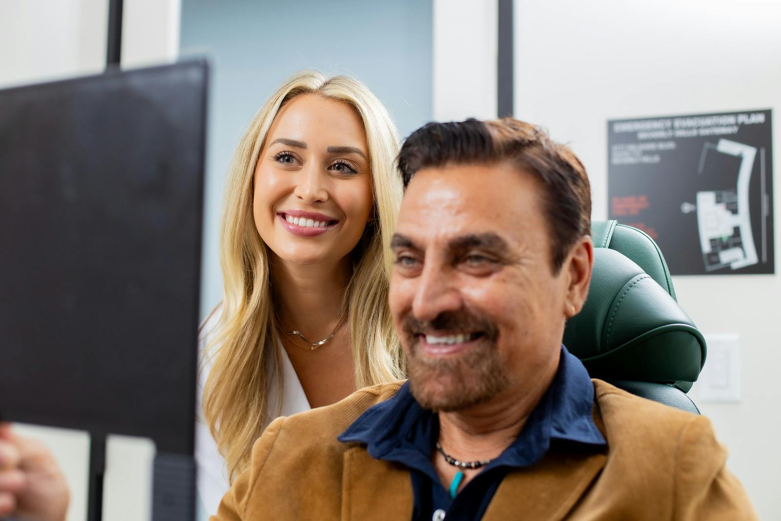 man looking at himself in a mirror