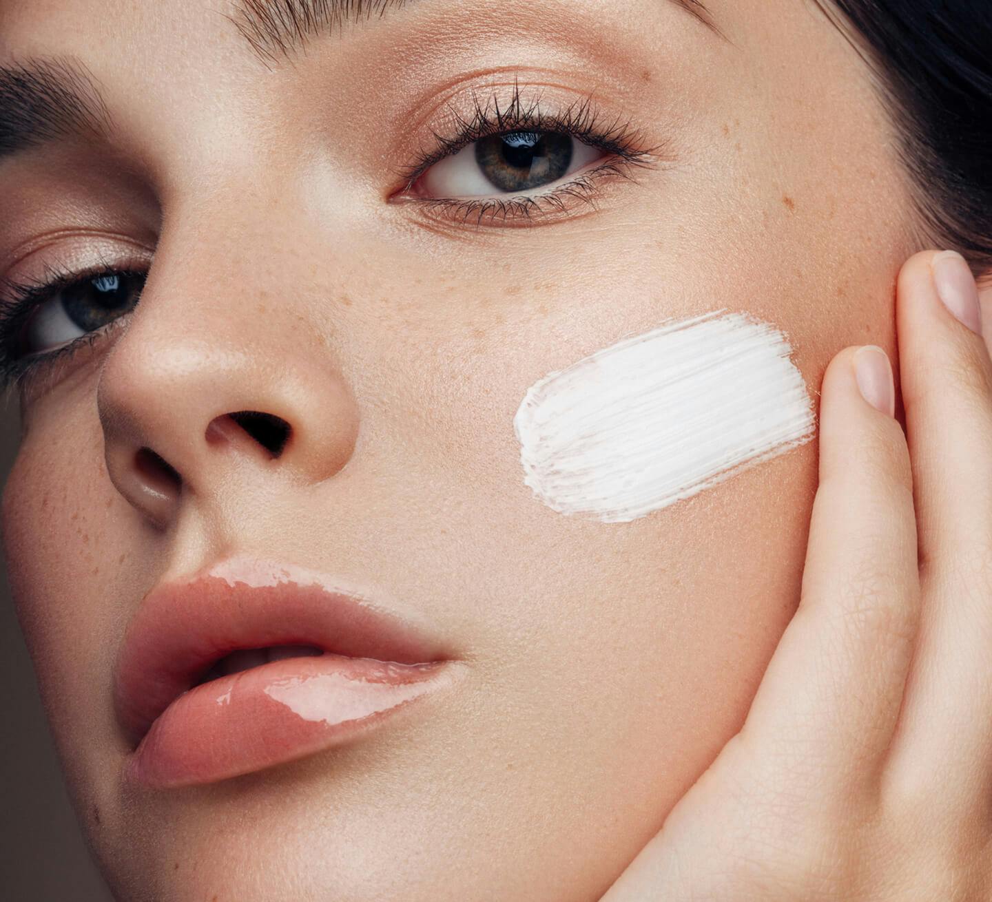 woman with lotion on face