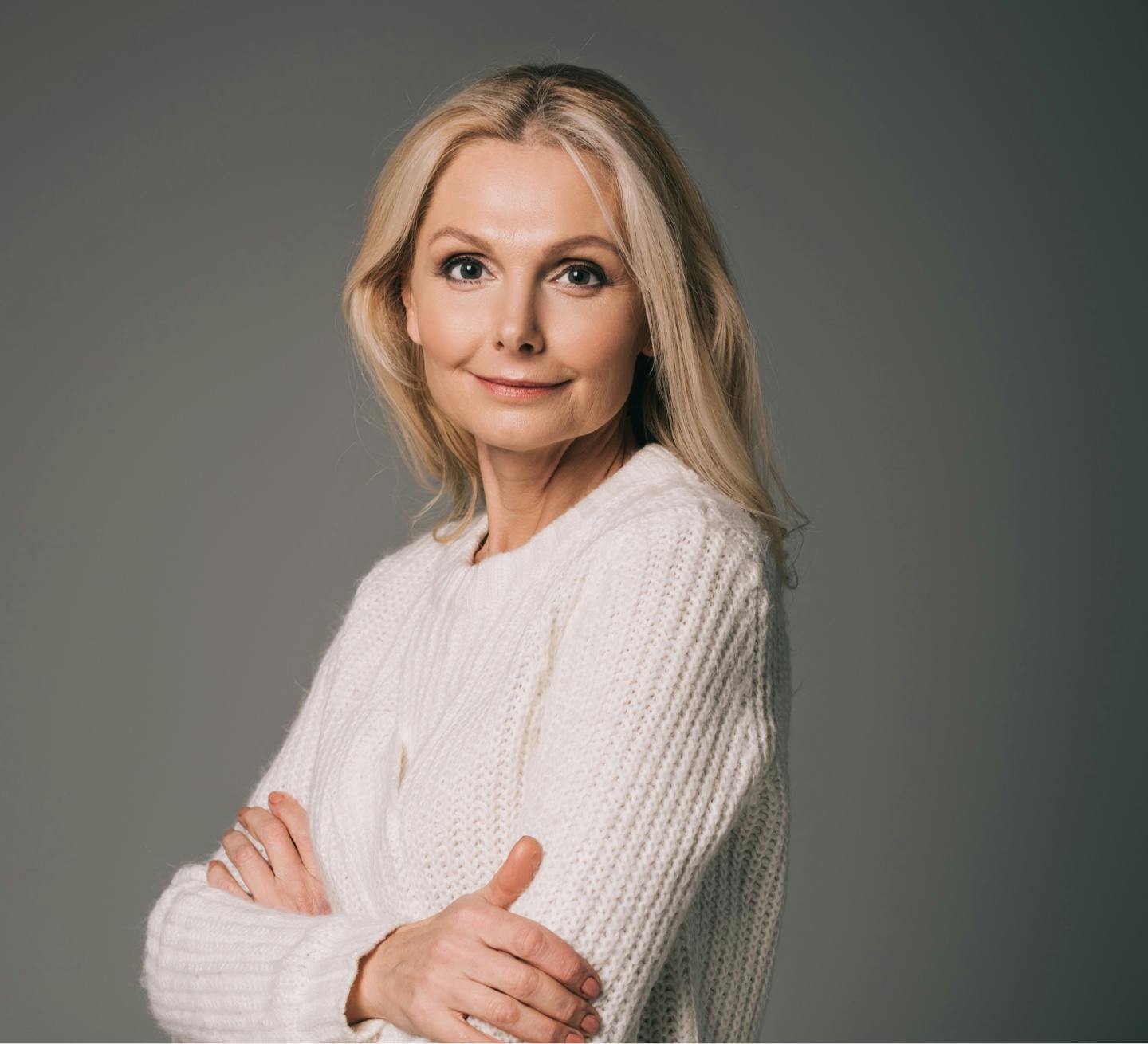 woman with her arms crossed looking at camera