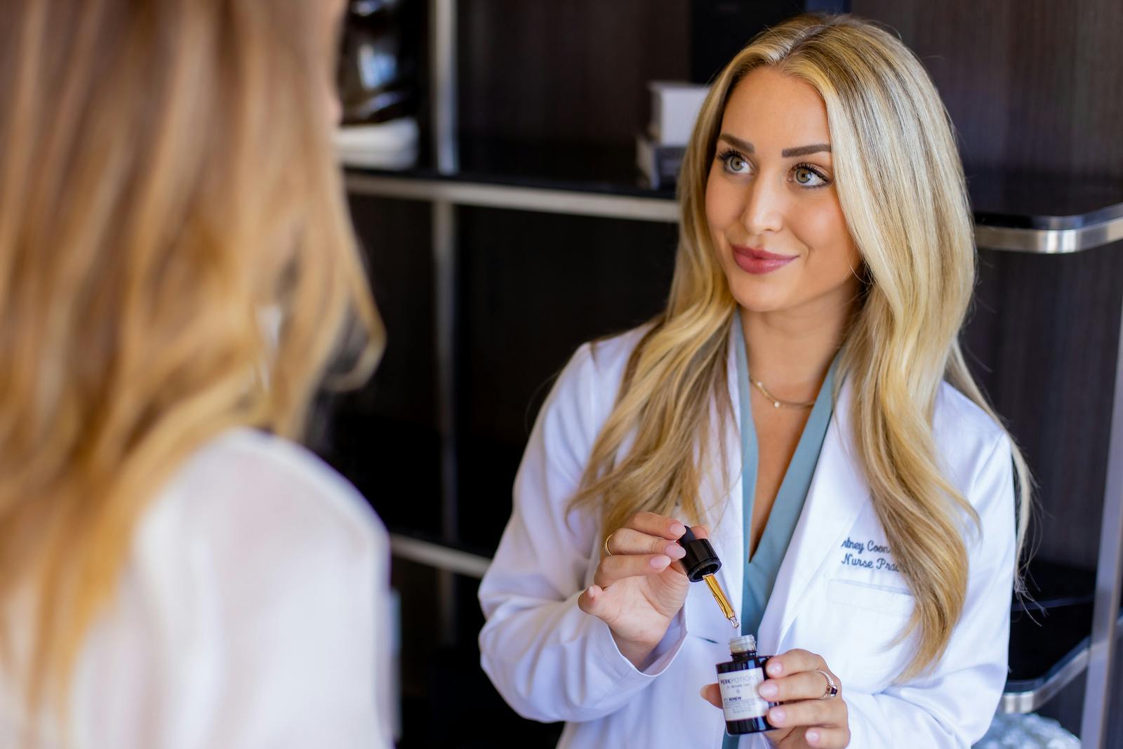 doctor holding skincare product