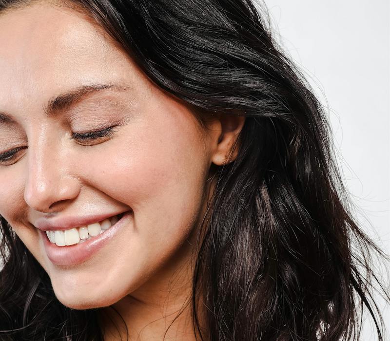 Woman closing her eyes and smiling