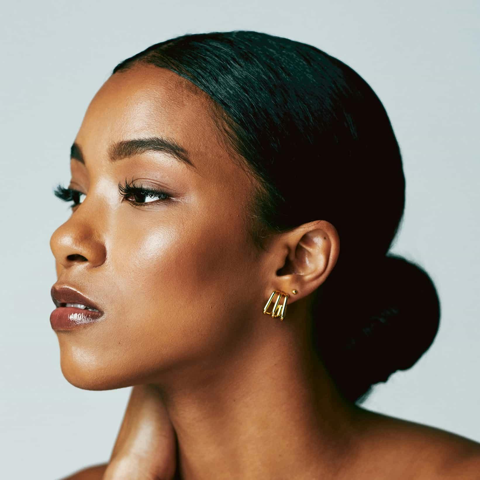 woman with her hair in a low bun