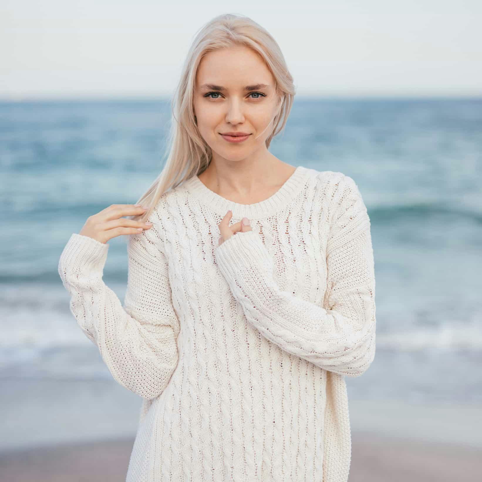woman in a white sweater