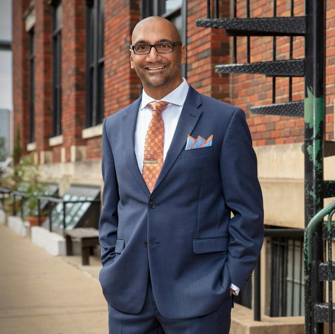 Dr. Setty in a blue suit