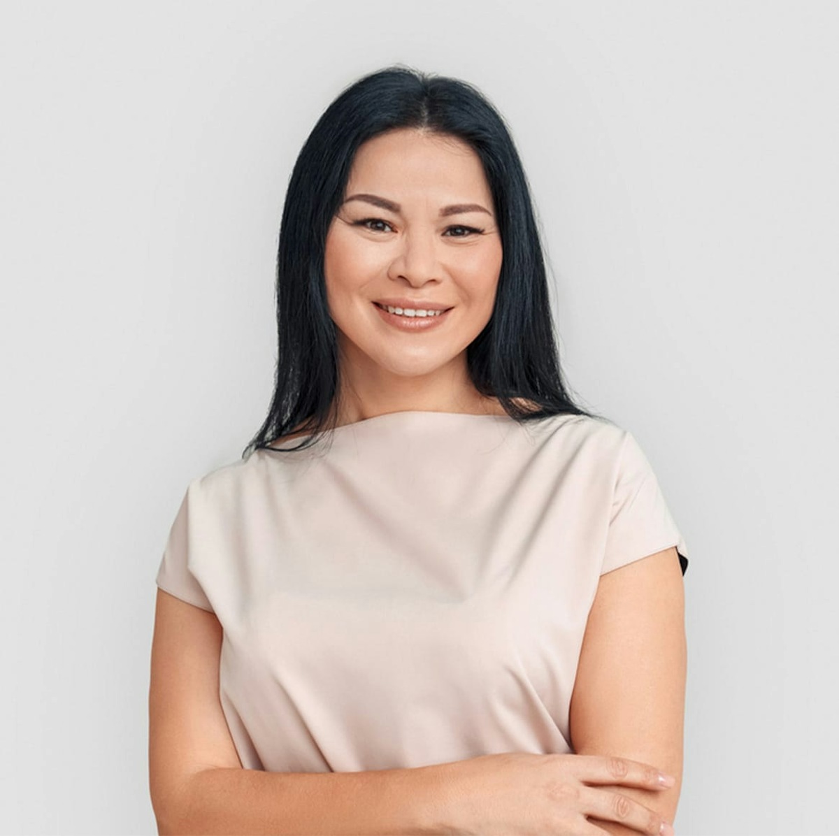 woman with blonde hair smirking