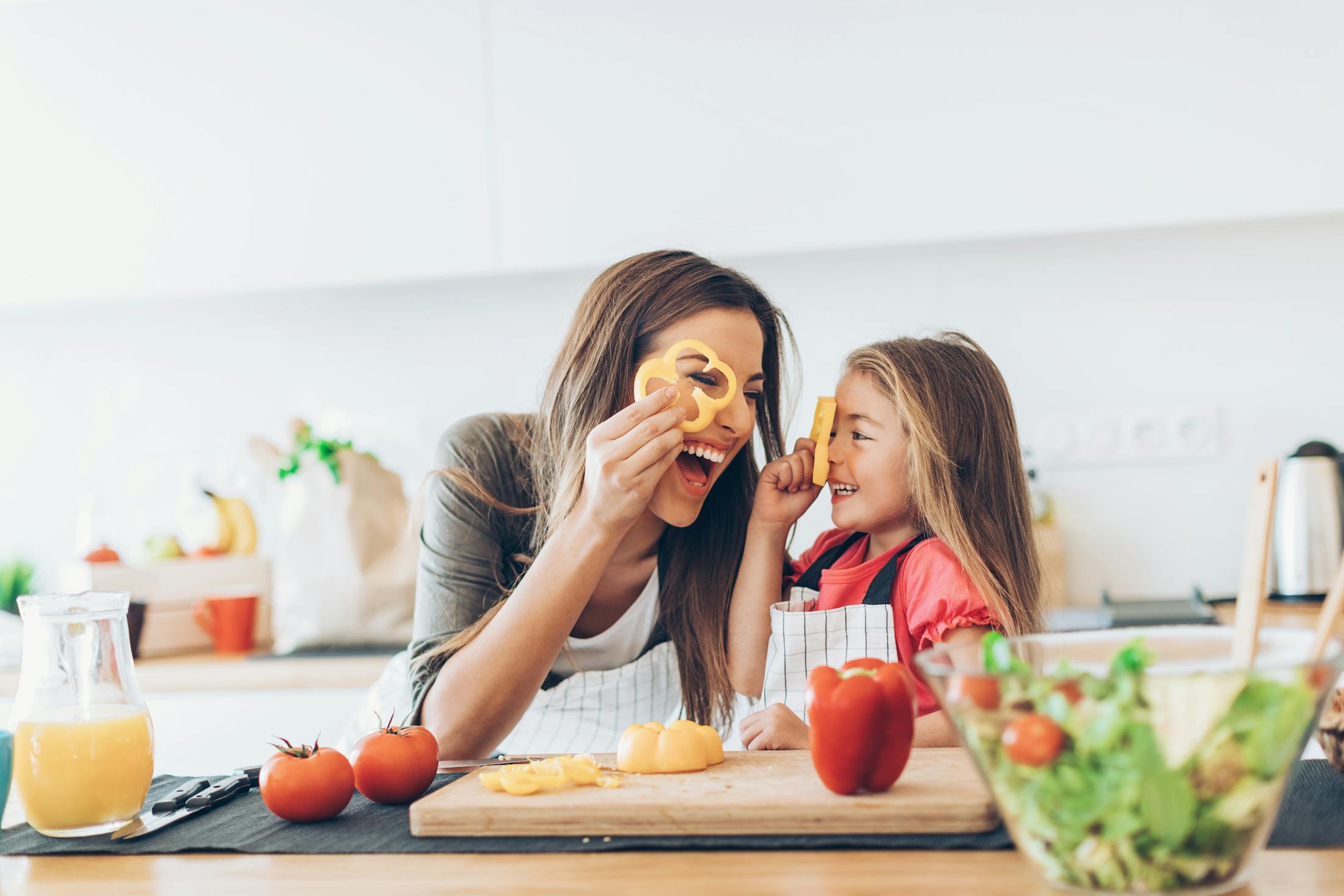 Woman cooking with child
