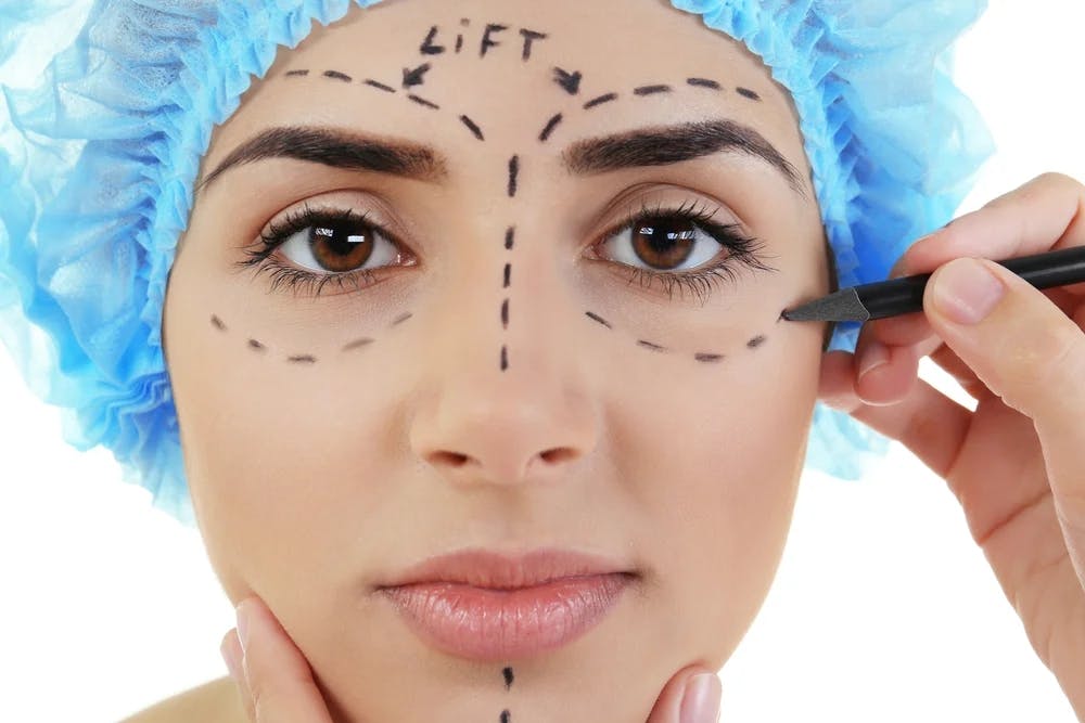 woman with marker on face