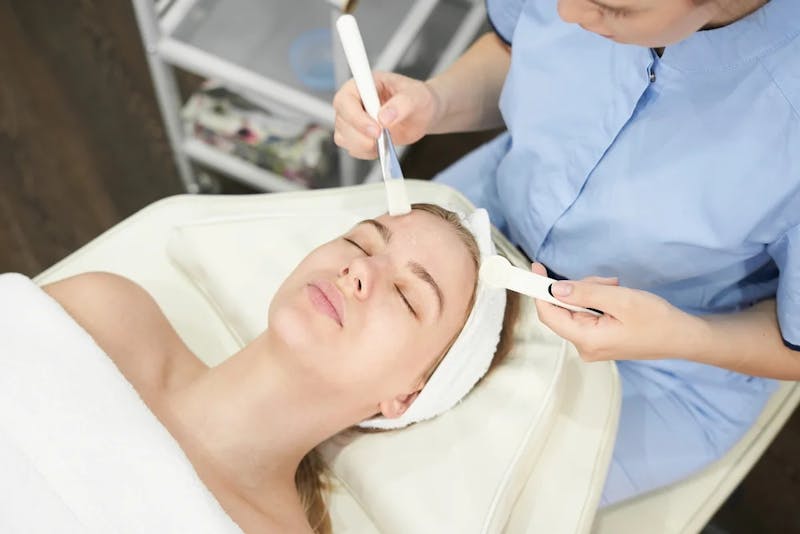 woman getting face treatment