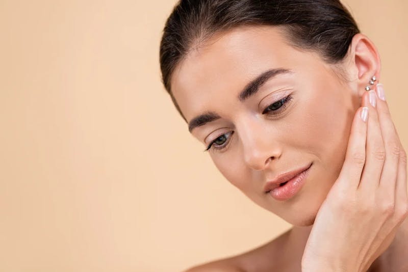 woman touching face