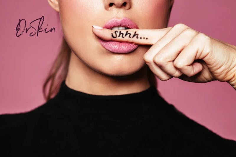 woman with finger in her mouth