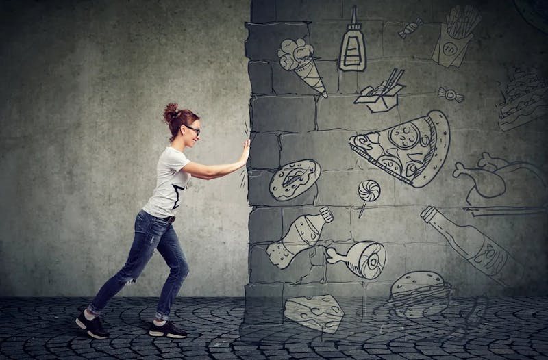 woman pushing wall graphic