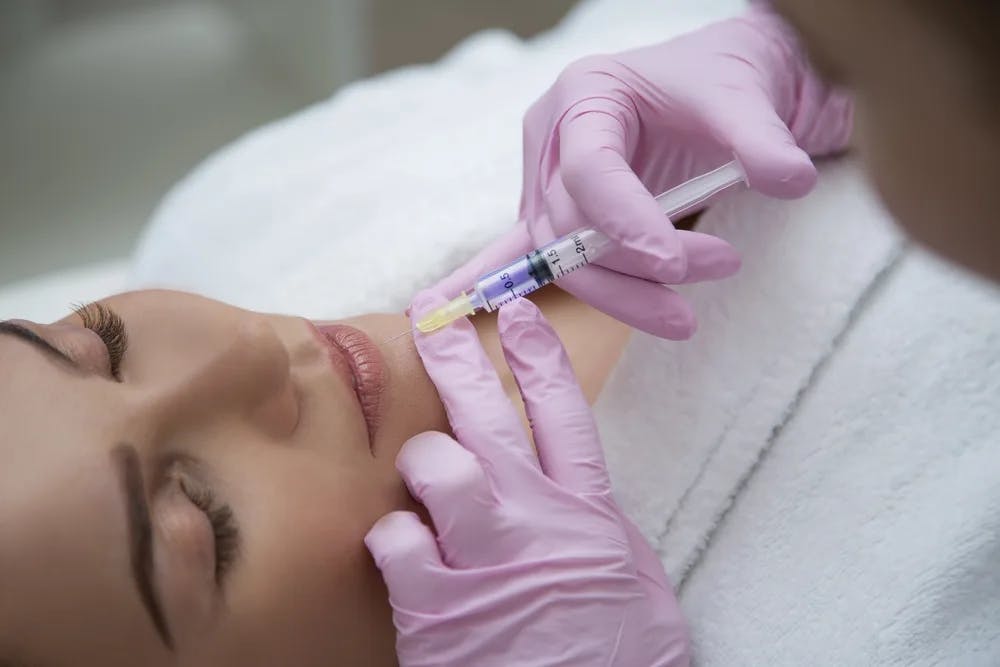 woman getting lip fillers