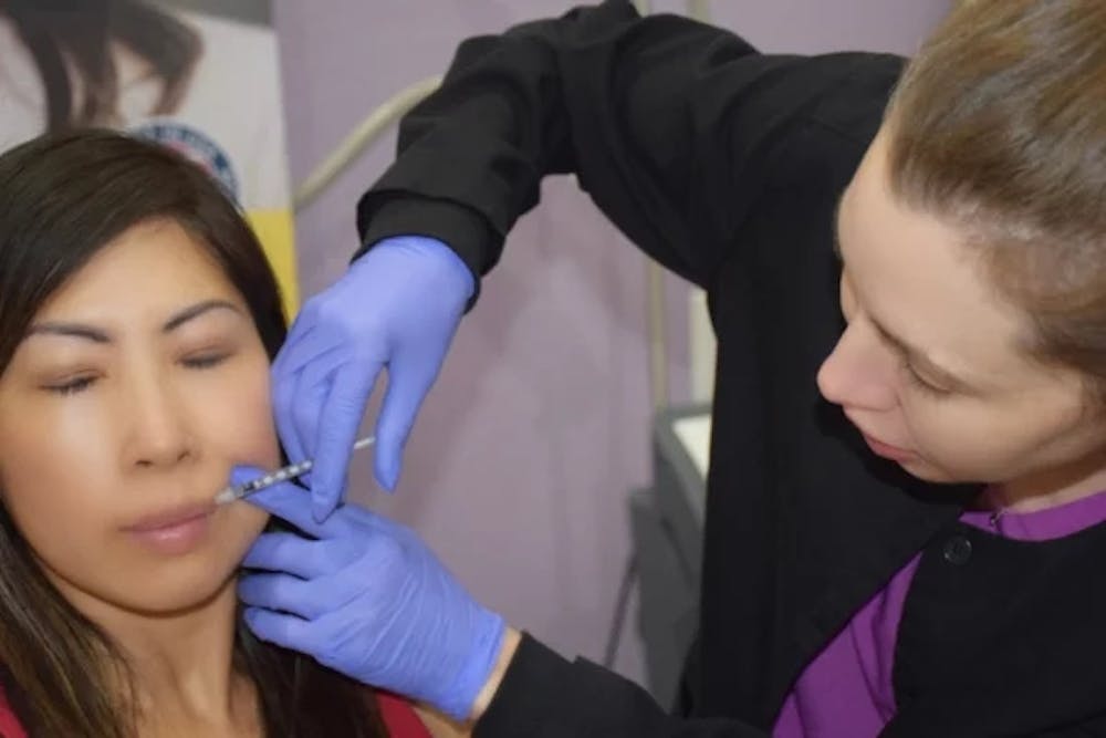 woman getting lip injections