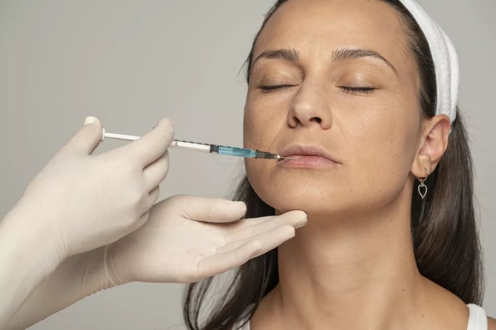 person getting lip injections