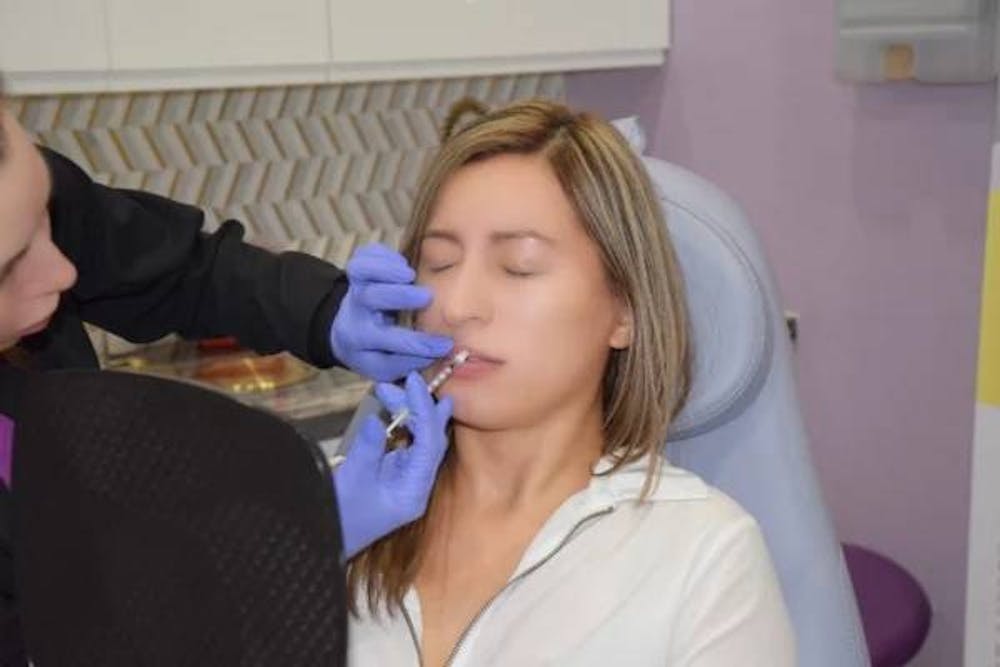 woman getting lip injections