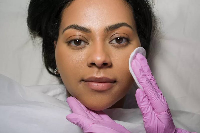 woman preparing for facial treatments