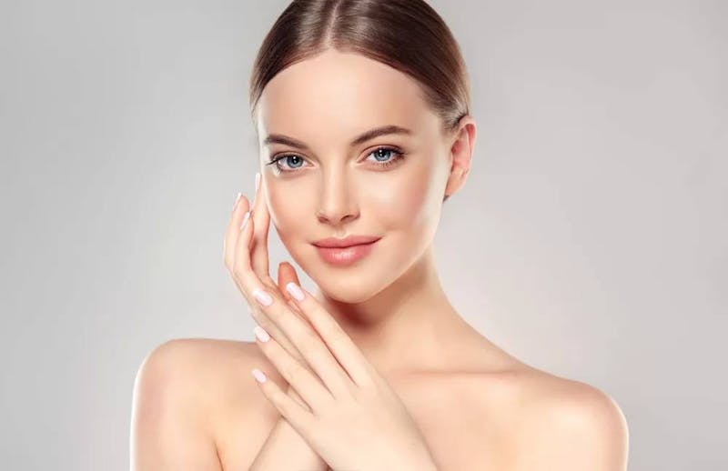 woman touching face