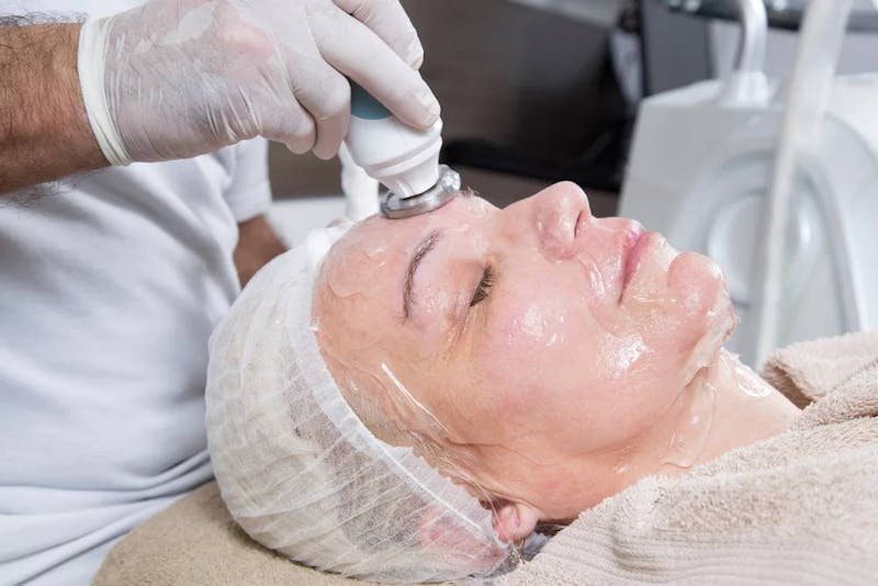 woman getting facial treatment