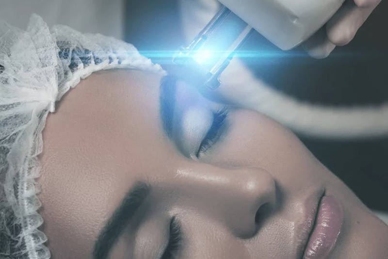 woman getting face treatment