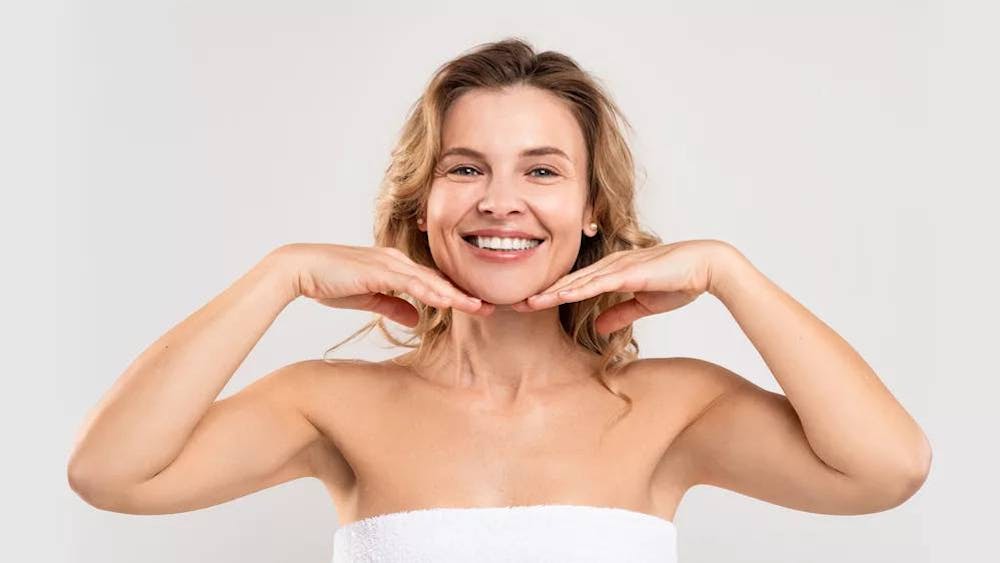 smiling woman touching her chin