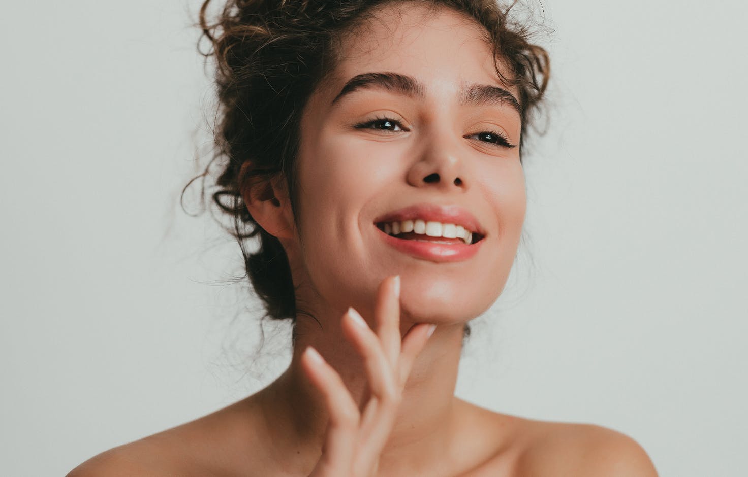 woman touching her chin