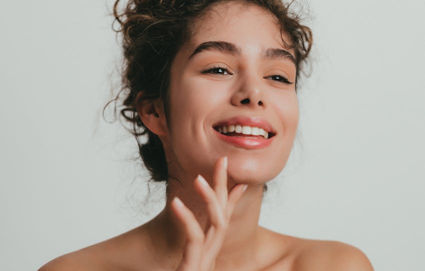 woman touching her chin
