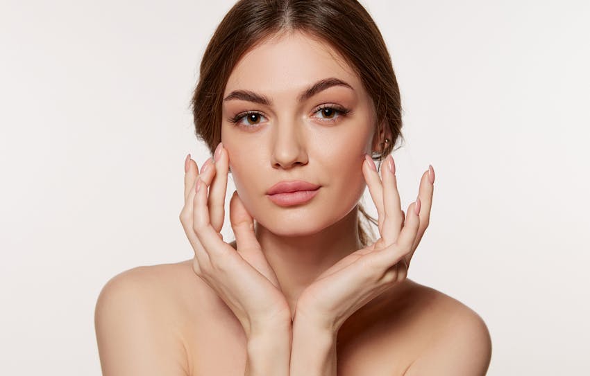 Woman touching her face