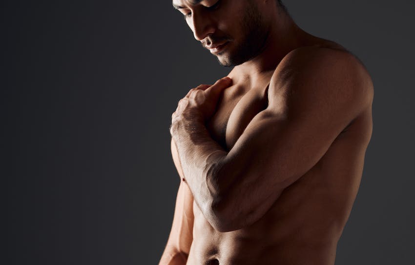 man grabbing his chest