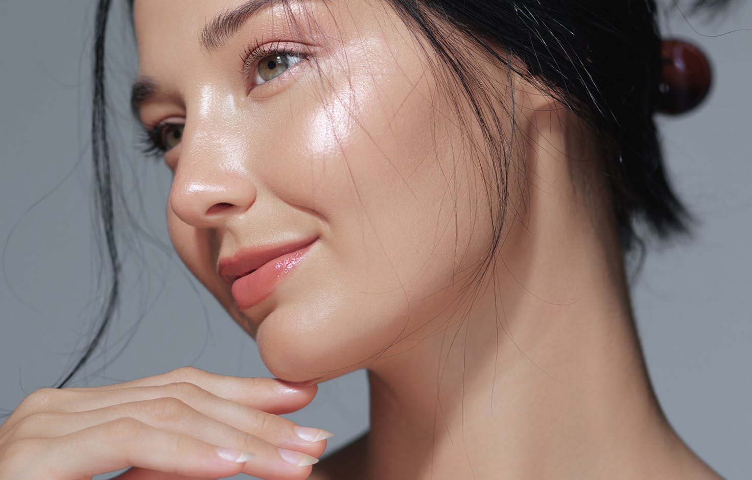 model posing holding her face