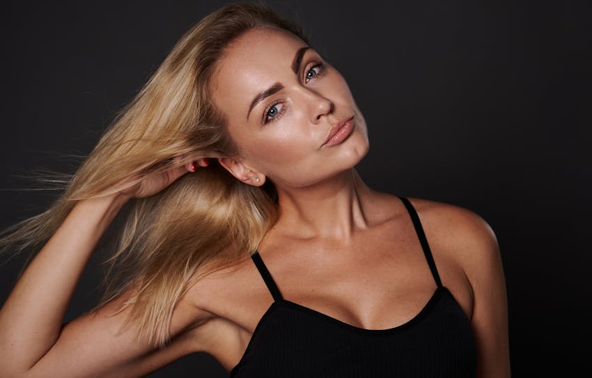 Woman touching her hair