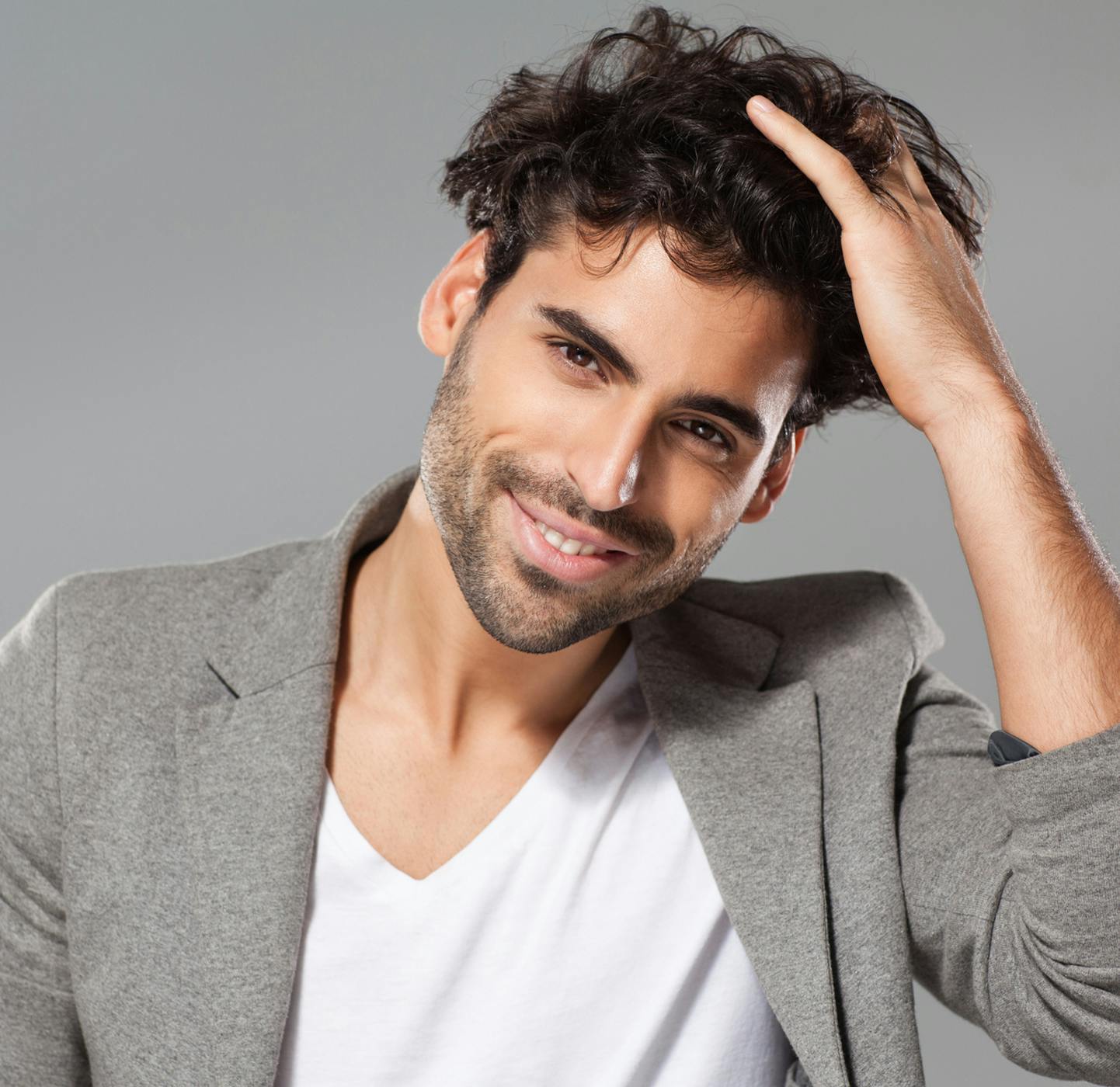 male model posing with hand in hair
