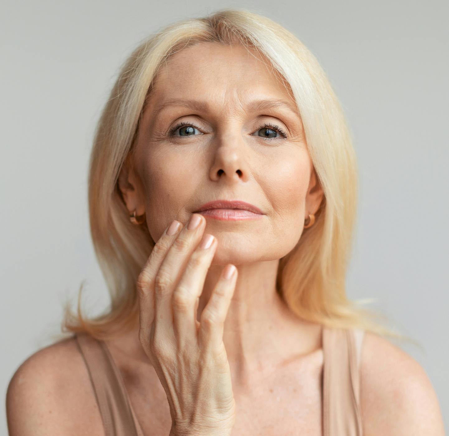 Woman touching her face