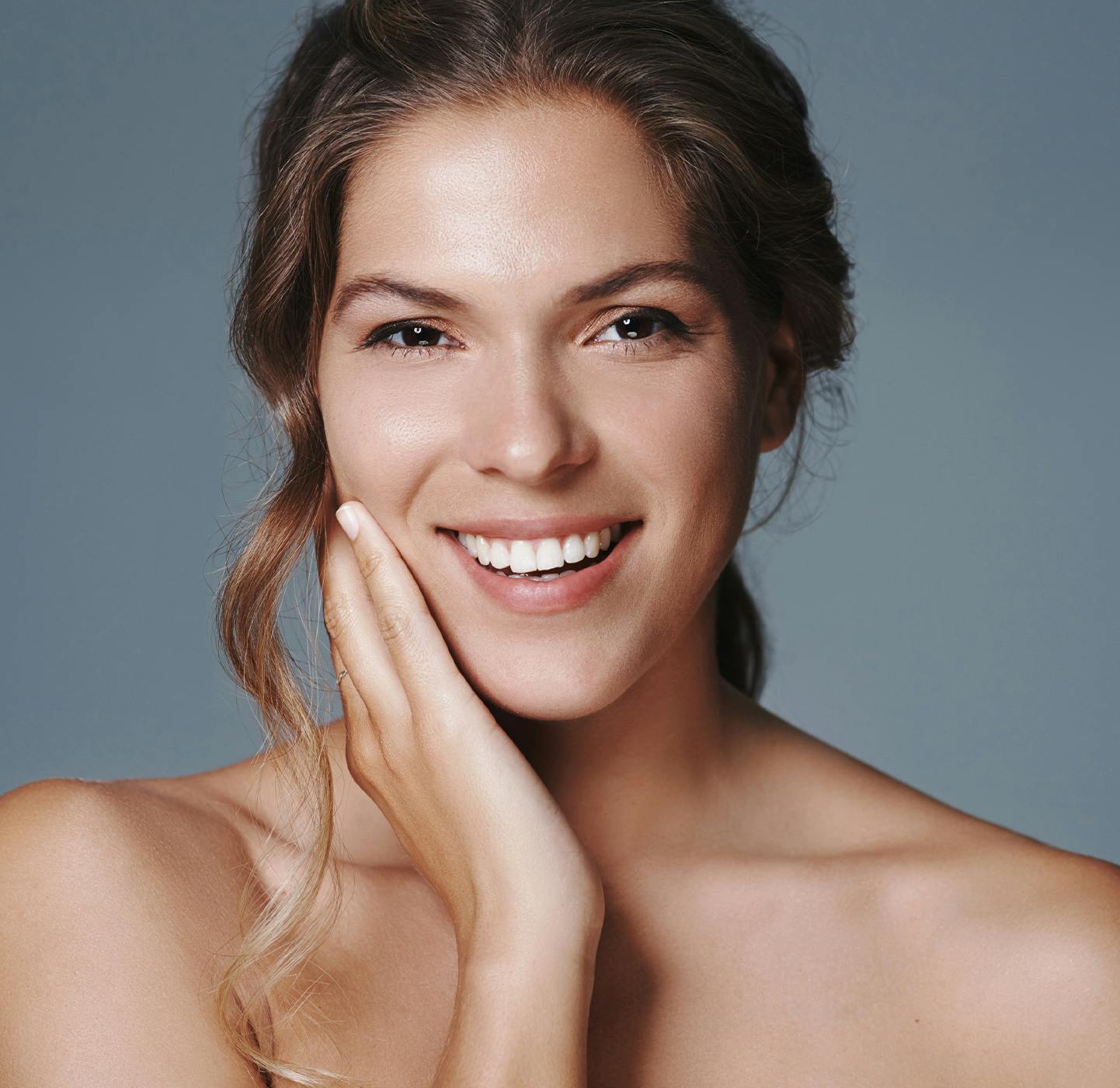 woman touching her face