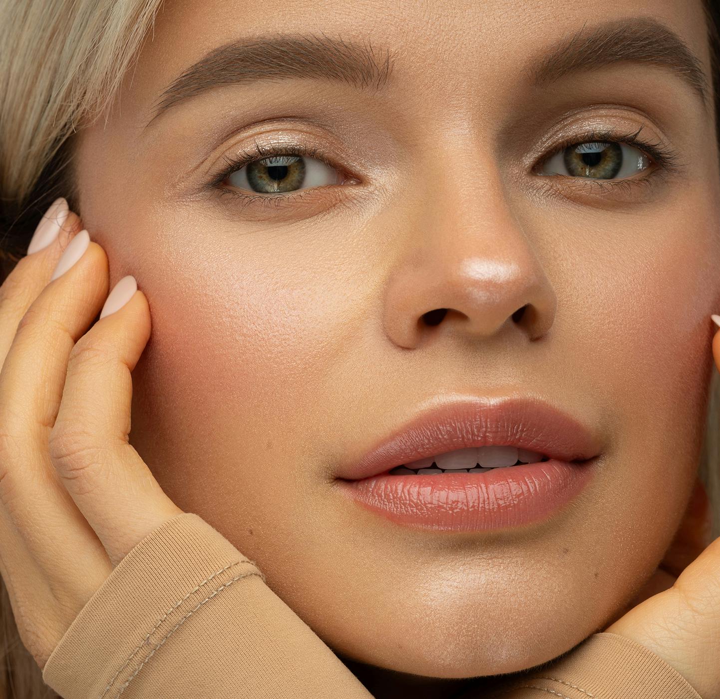Woman touching her face