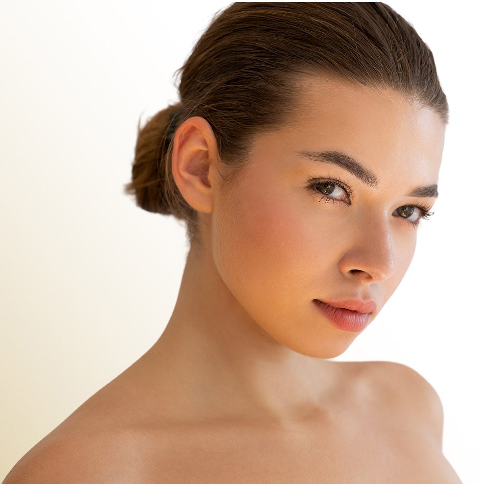 woman with her hair in a bun