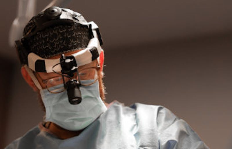 doctor performing surgery