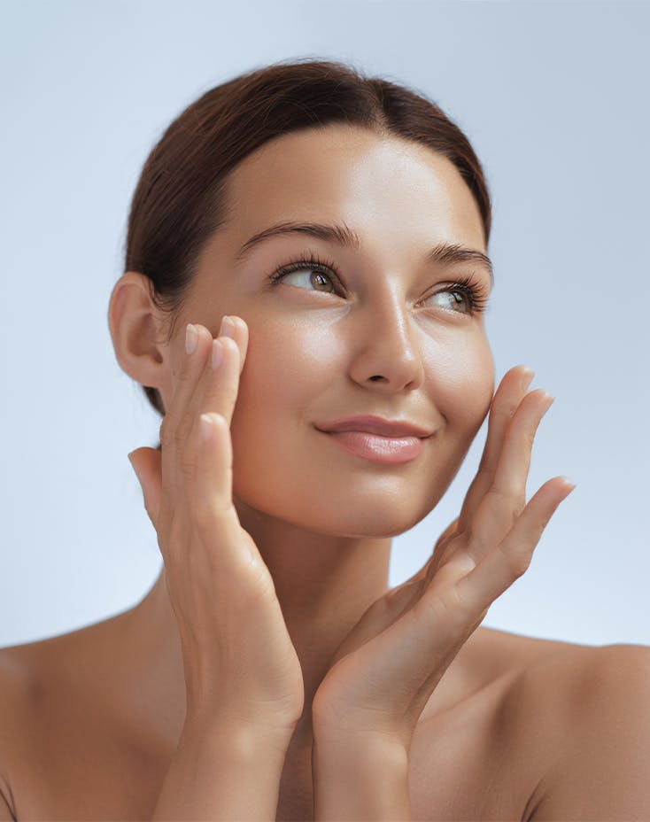 woman with hands on her cheeks