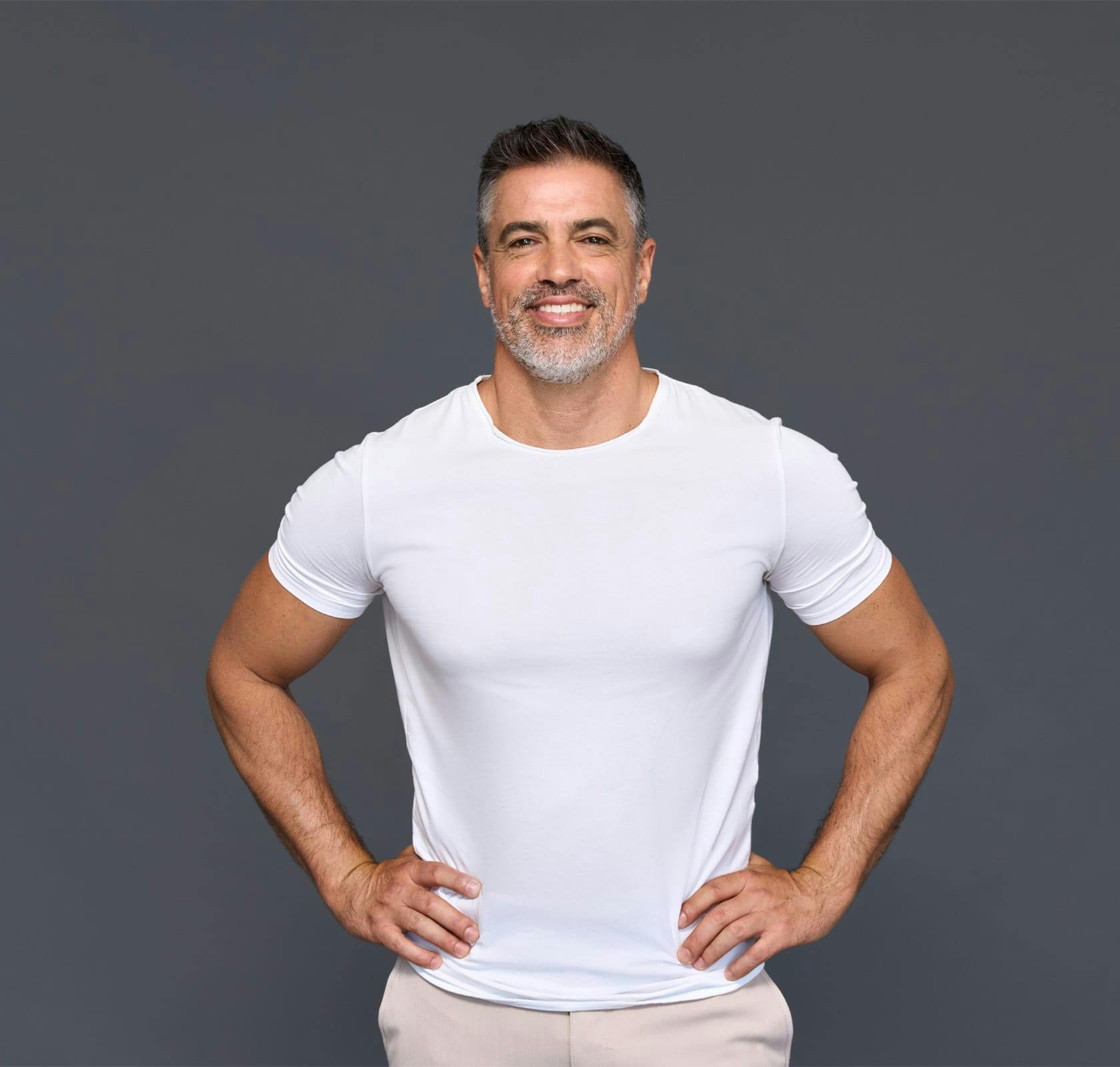 older man with hands on his hips