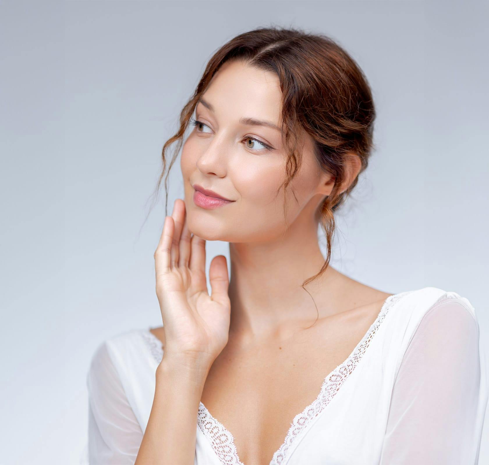 woman touching her face